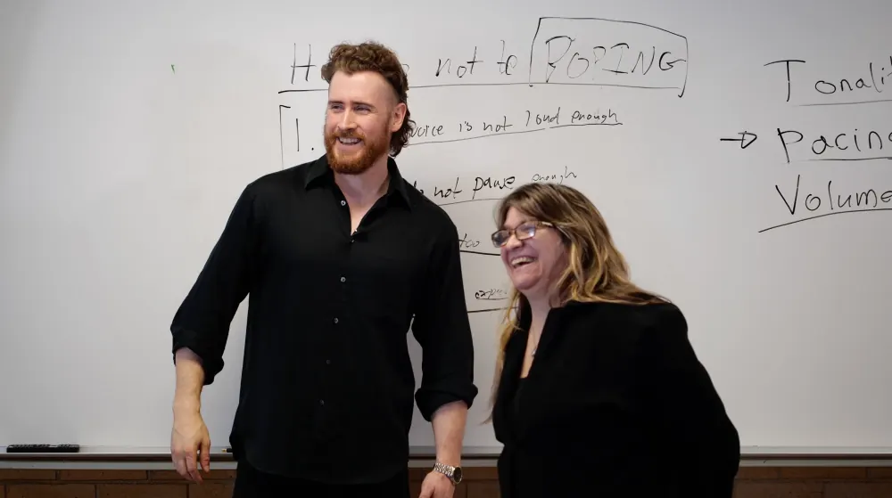 Authority — Joseph laughing with a participant at the whiteboard